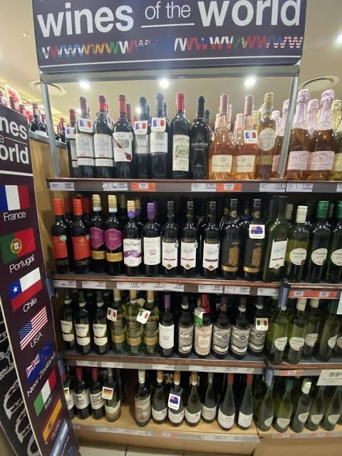 Wine section with red and white bottles on display